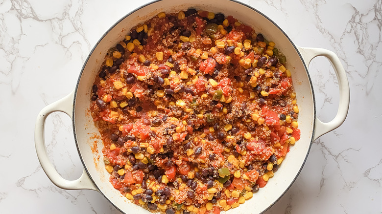 stuffed pepper filling ingredients simmering in pan