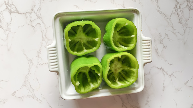 prepping bell peppers for stuffed peppers