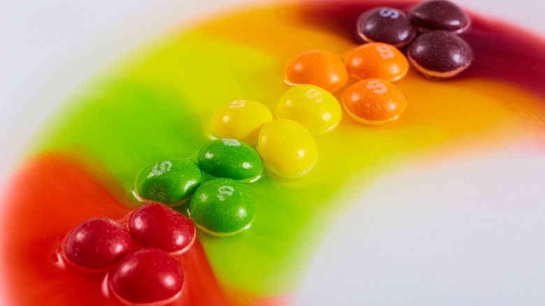 Multi-colored candies melting