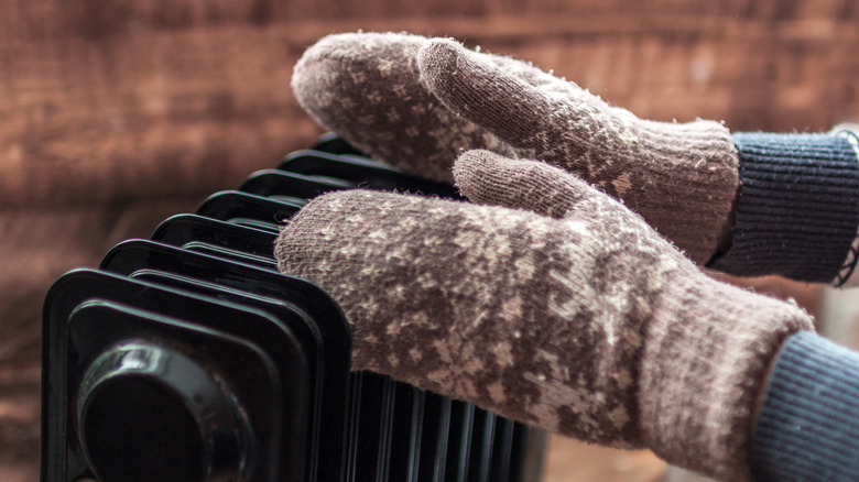 woman wearing mittens with heater