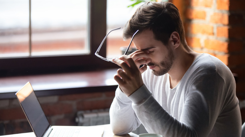 Man having an emotional meeting via laptop 