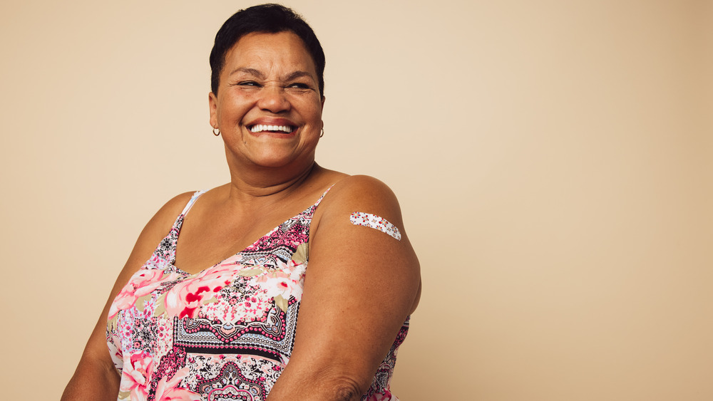 Woman smiling after vaccine