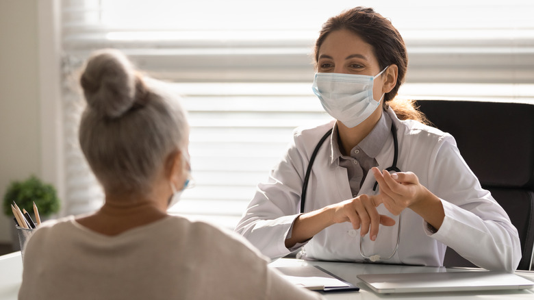 A doctor talking to her patient