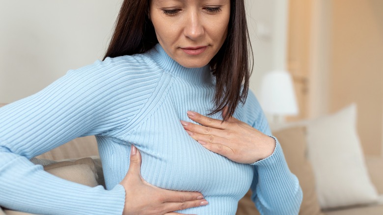 woman doing a self-breast exam