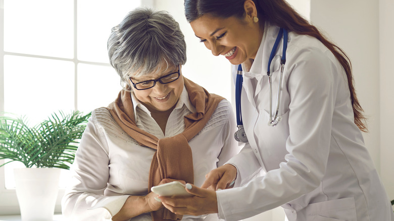 An older woman talking with her doctor