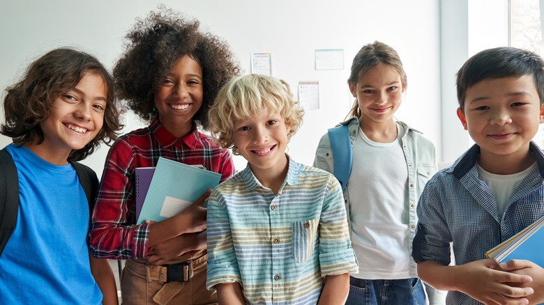 diverse group of young students looking into camera