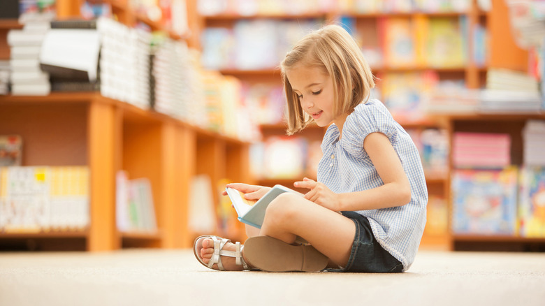 girl reading alone in the library