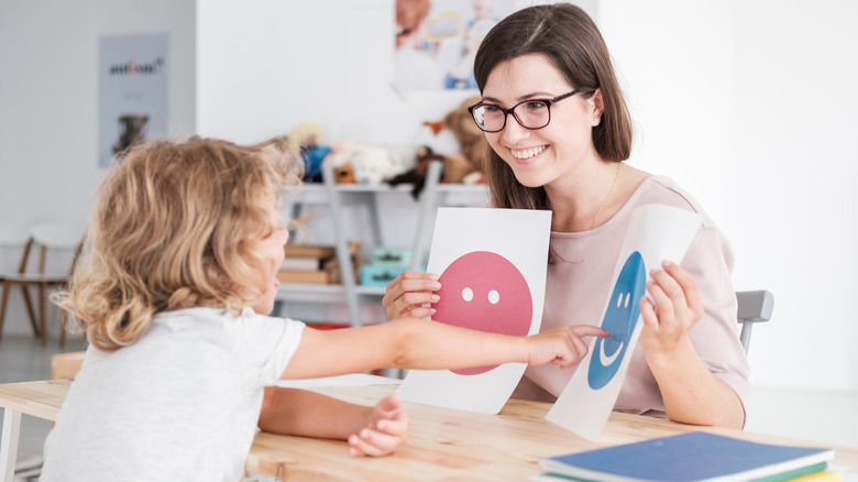 counselor working with a child with autism