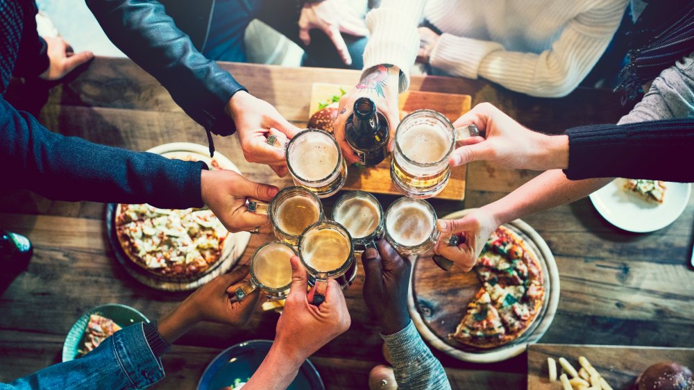 Group of single friends toasting drinks