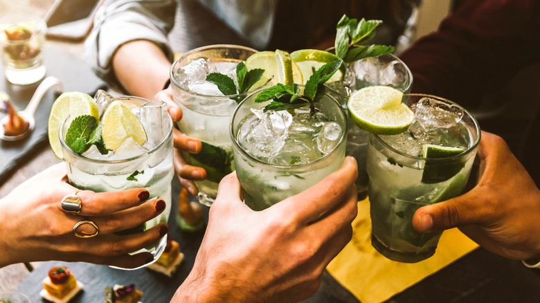 group of friends holding drink glasses