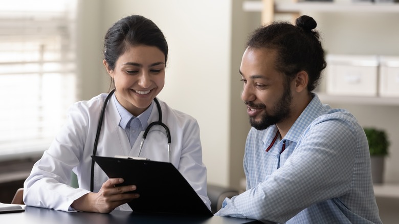 man consulting with doctor