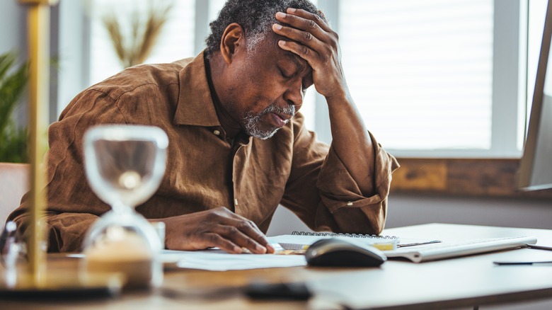 working man with headache