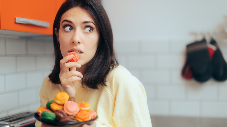 woman sneaking food