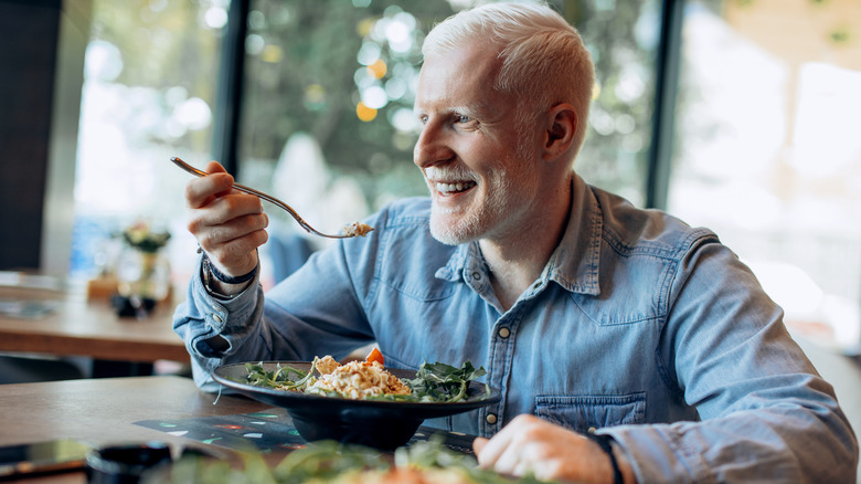 older man eating a healthy meal