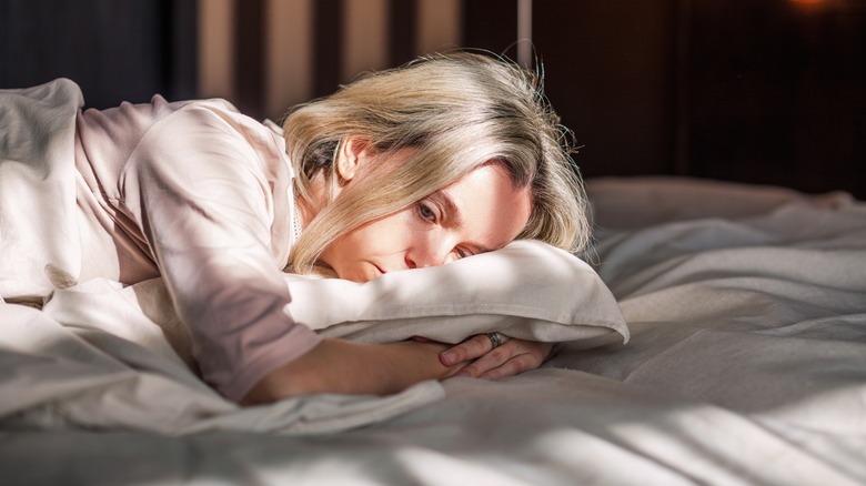 woman lying in bed insomnia