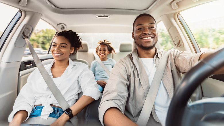 Family sitting in car