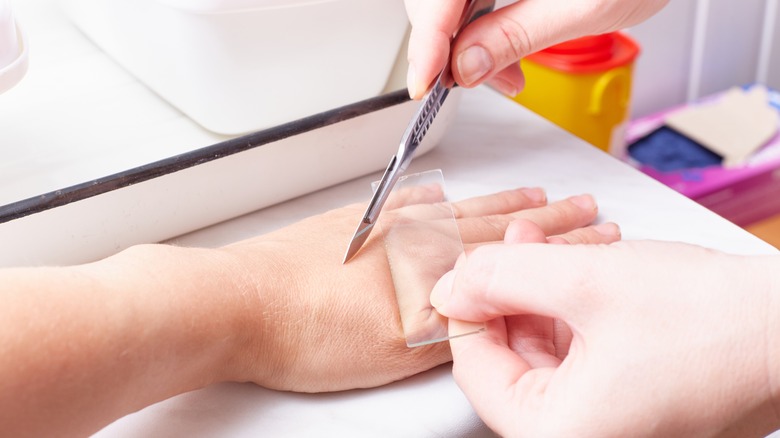 Scalpel scraping skin for skin test