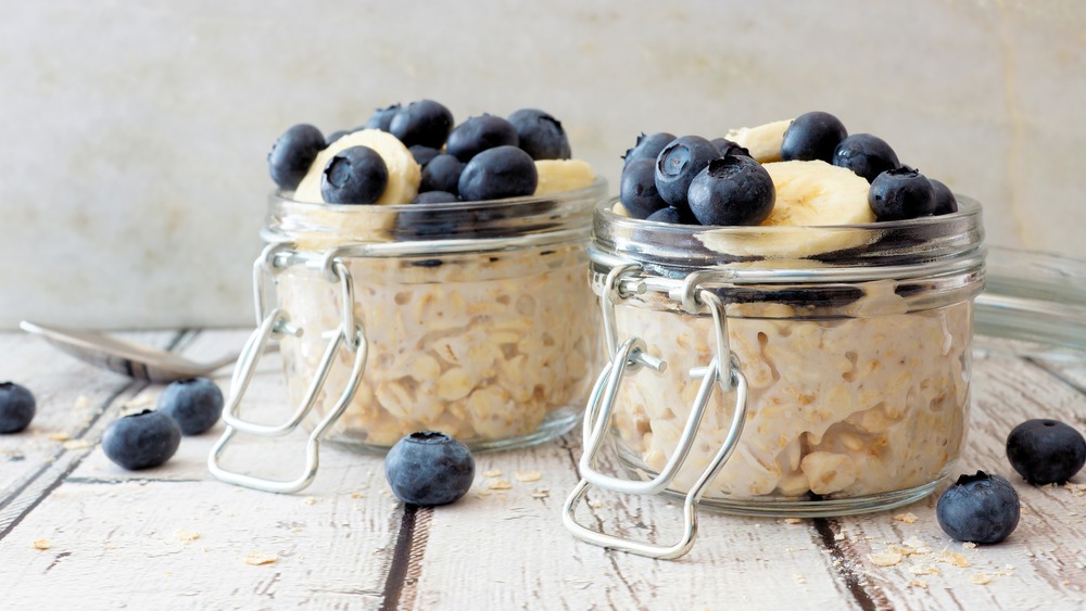  overnight oats in glass jar topped with blueberries 