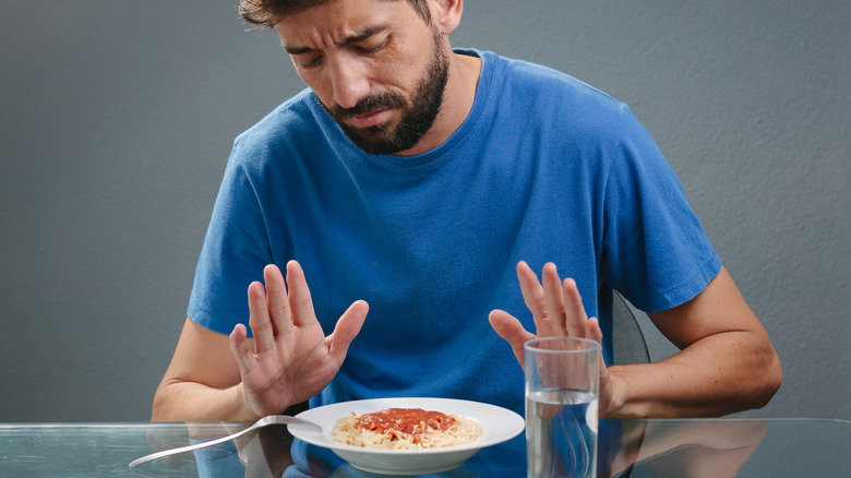 Man with no appetite refusing food