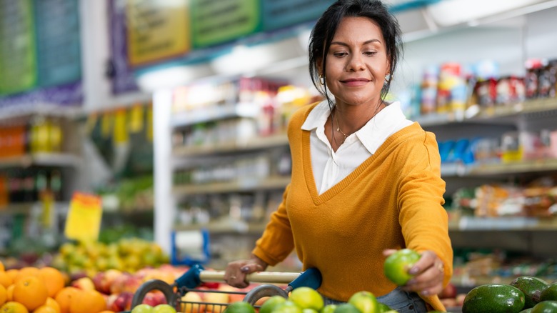 Woman shopping for fruit