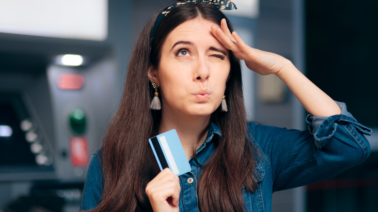 Woman forgetting ATM pin