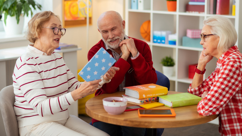 mature friends having book club