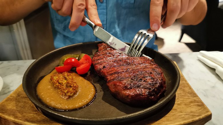 Man eating steak