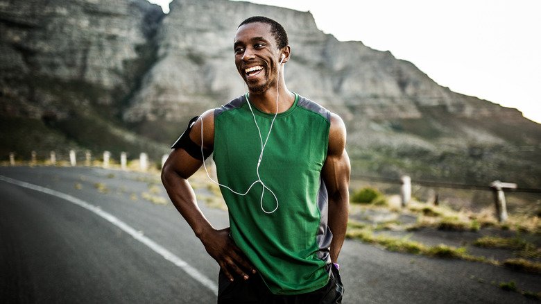 Muscular man running outdoors