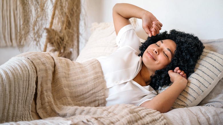 Smiling woman waking up