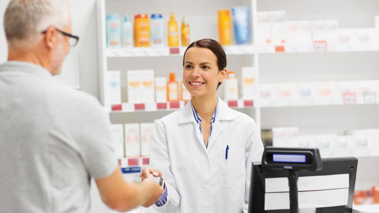 Customer paying at pharmacy