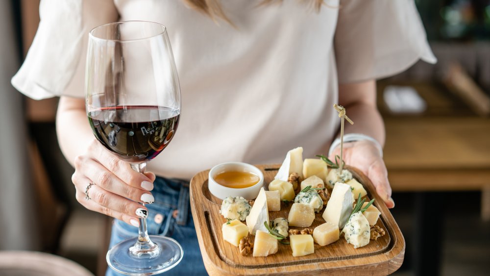 woman with wine and cheese