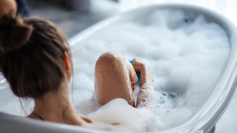 Woman taking relaxing bath