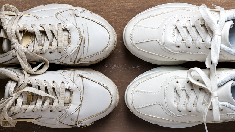 A pair of worn-out sneakers next to a pair of new sneakers