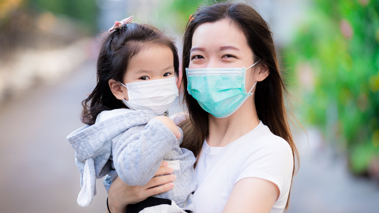 mom and child wearing masks