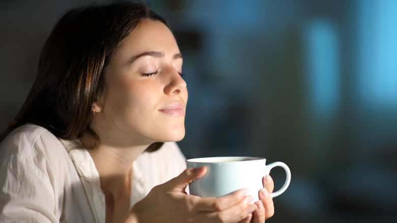 Woman holding a cup of coffee