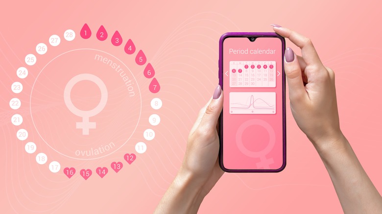 a period tracking app on a pink background 