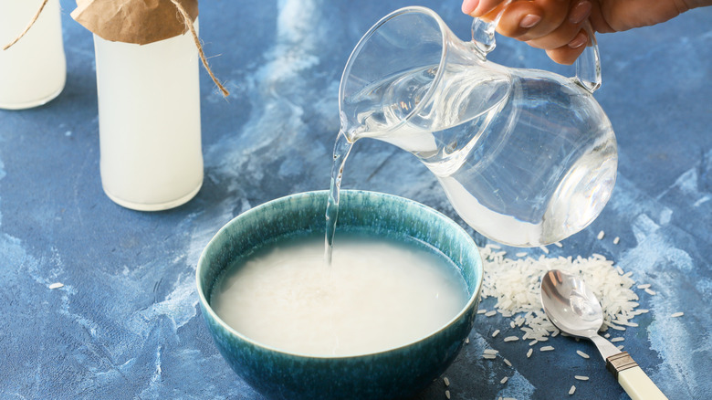 a person making rice water