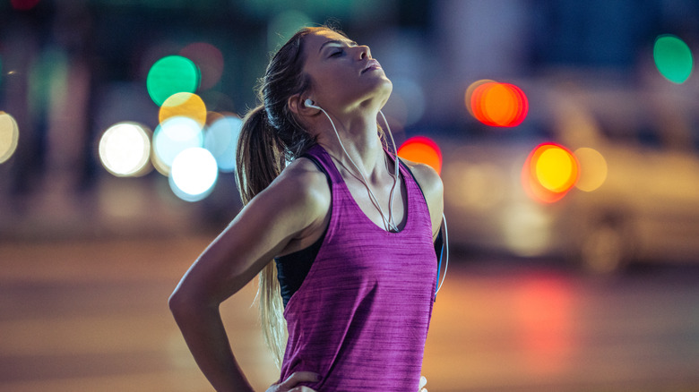 woman finishing her nighttime run