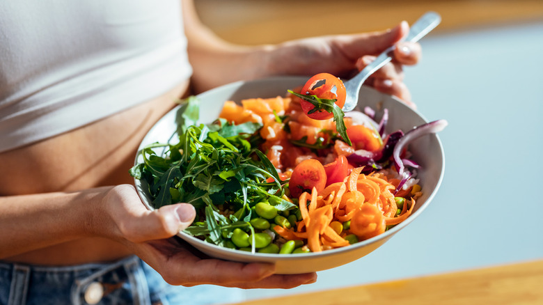 woman enjoying a healthy carb dinner