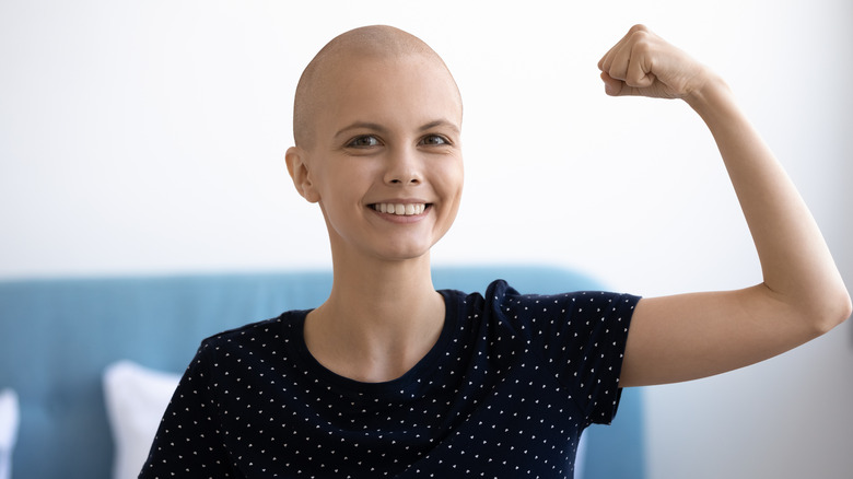 A cancer patient flexing
