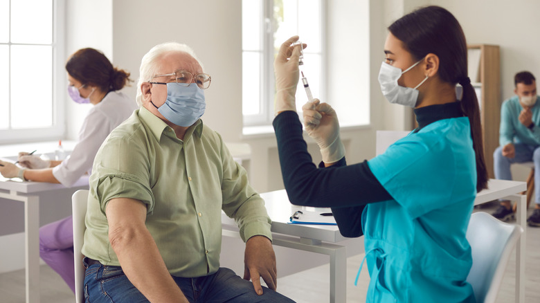 A man gets vaccinated