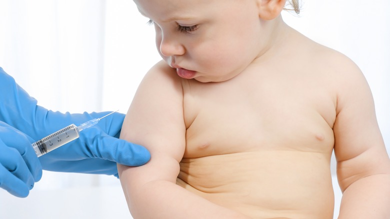 Child getting vaccine on arm