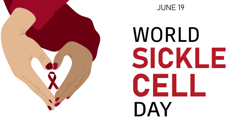 Sickle cell ribbon inside two hands