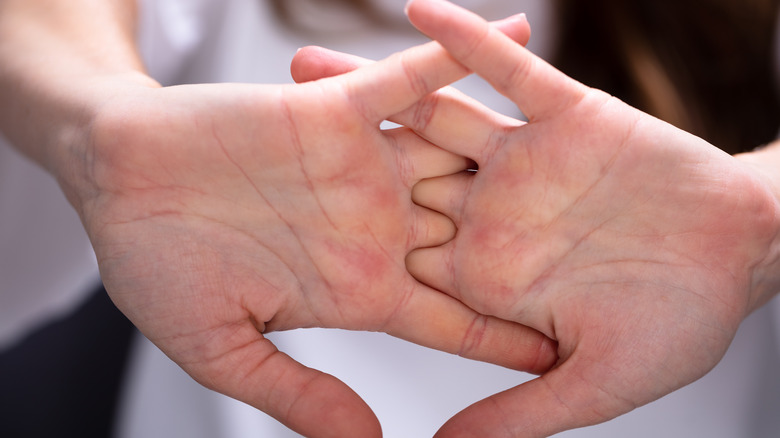 Close up of woman cracking her knuckles