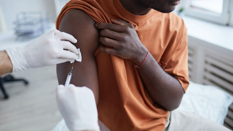 A man gets a COVID vaccine