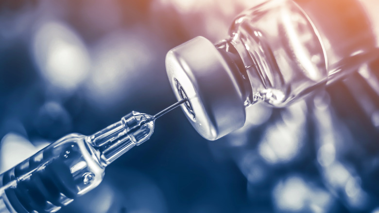 Syringe in vaccine vial