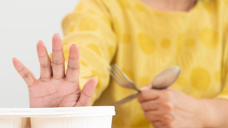 senior woman refusing to eat