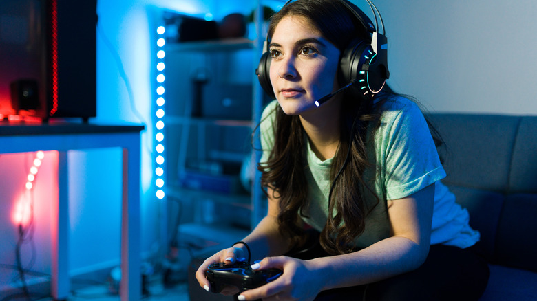 Female teen playing video game
