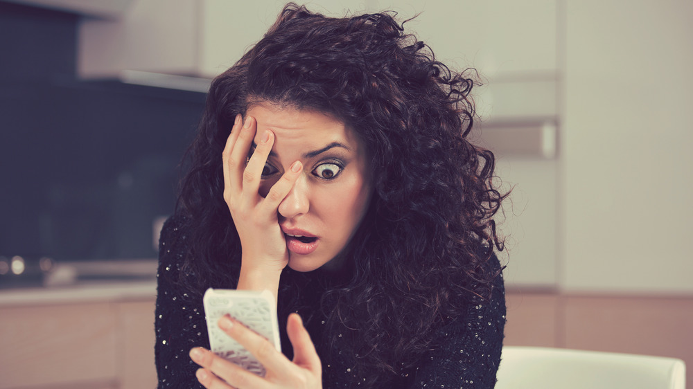 woman surprised by phone