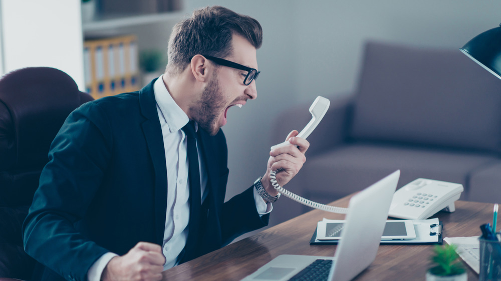 Narcissist boss screaming into phone